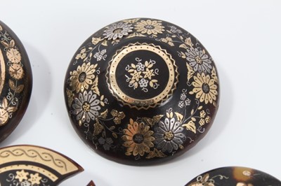 Lot 4 - Group of five 19th century tortoishell piqué work brooches various, with floral and lattice work decoration. 32-35mm diameter