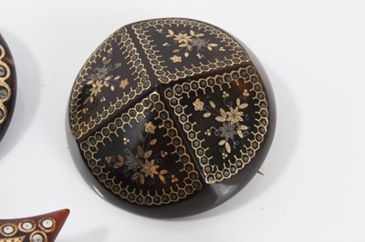 Lot 5 - Group of five 19th century tortoishell piqué work brooches various, with floral decoration to include a Maltese cross brooch, 32-40mm diameter