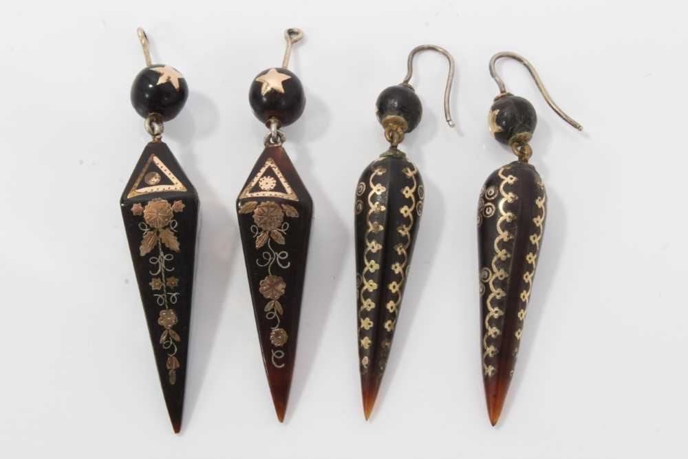 Lot 9 - Two pairs of 19th century piqué work earrings with star and floral decoration, approximately 60mm length