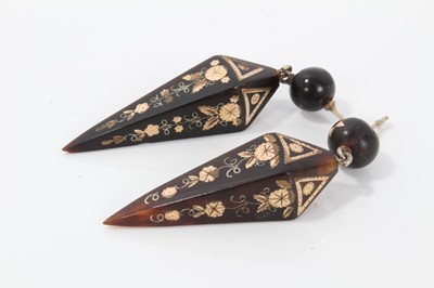 Lot 9 - Two pairs of 19th century piqué work earrings with star and floral decoration, approximately 60mm length