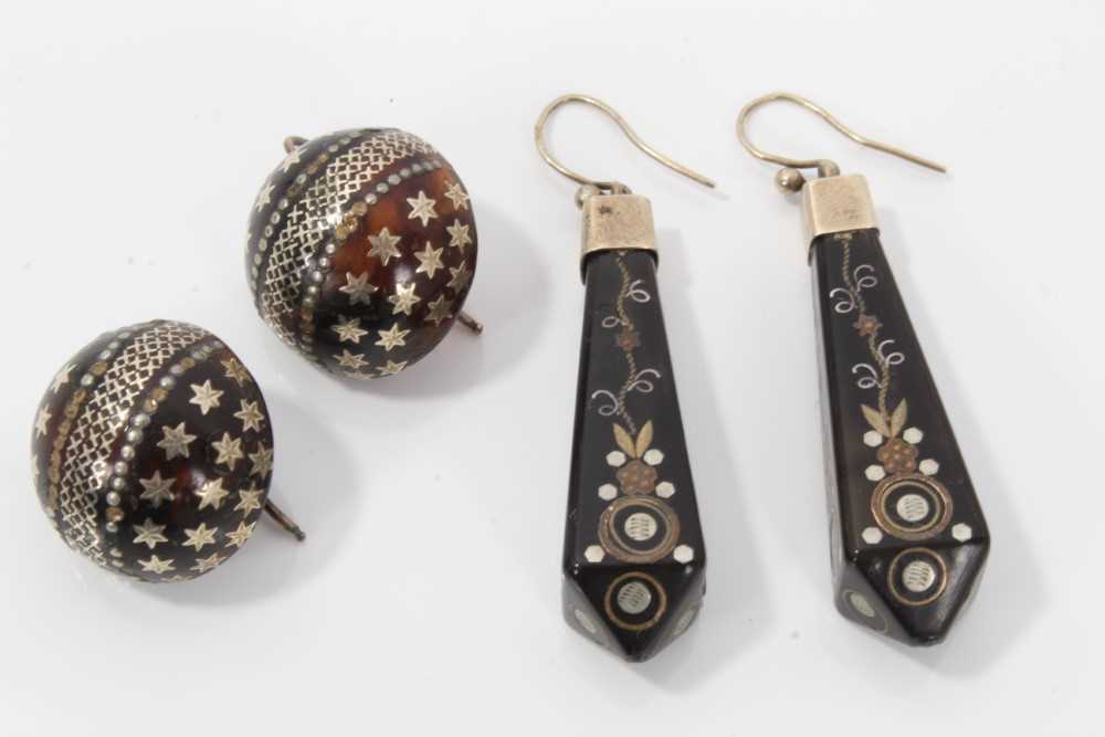 Lot 10 - Two pairs of 19th century piqué work earrings, one pair of circular domed form with star decoration, 20mm diameter and the other pair with floral decoration 50mm