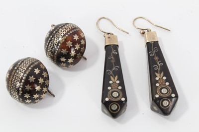 Lot 10 - Two pairs of 19th century piqué work earrings, one pair of circular domed form with star decoration, 20mm diameter and the other pair with floral decoration 50mm