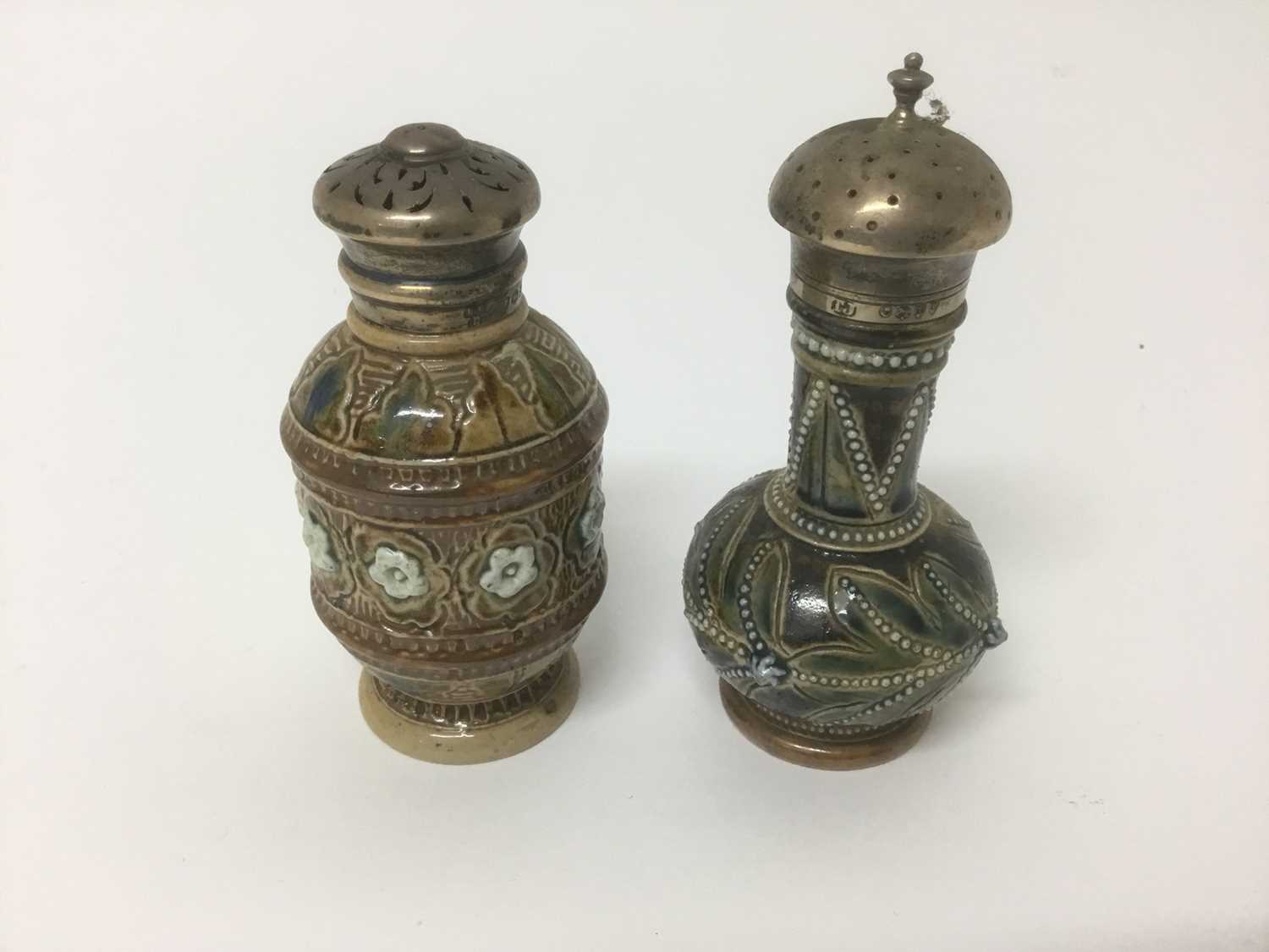 Lot 52 - Two late 19th silver mounted Doulton Lambeth castors