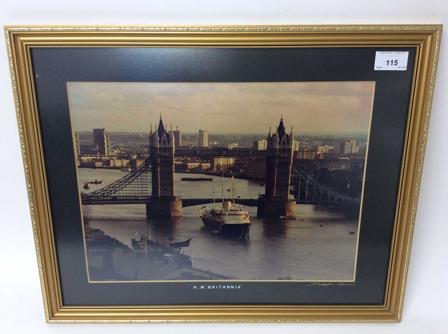 Lot 115 - The Royal Yacht ' Britannia ' - fine colour photograph of the Yacht by Tower Bridge in the pool of the Thames , in glazed frame and signed by the photographer Charles Adams with copy of a letter to...