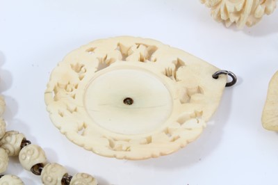 Lot 14 - Group of antique ivory, bone and similar  jewellery to include a 1920s carved ivory pendant with central amethyst cabochon, finely carved 19th century Dieppe ivory brooch depicting roses, and other...