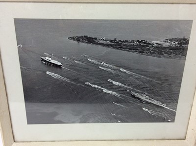 Lot 116 - The Royal Yacht 'Britannia' , three photographs of the Royal yacht being accompanied by small craft , in glazed frames