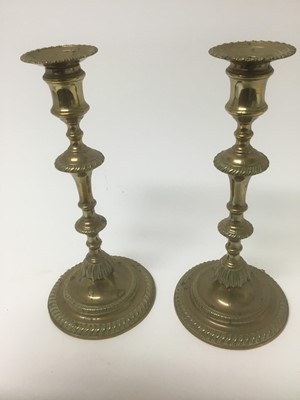 Lot 64 - Good pair of George III brass candlesticks