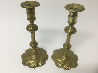 Lot 66 - Pair of George I / II wrythen brass candlesticks