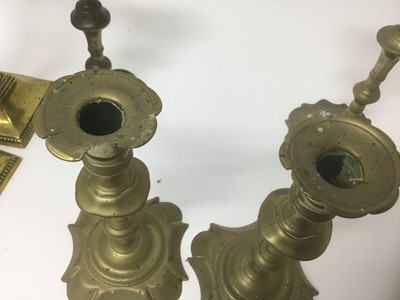 Lot 69 - Pair of George I / II brass candlesticks, together with two similar sticks and two later