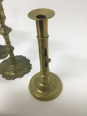 Lot 69 - Pair of George I / II brass candlesticks, together with two similar sticks and two later