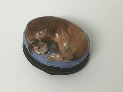 Lot 75 - 18th century South Staffordshire enamelled box, moulded with a lion, the hinged base with legend, 4cm wide