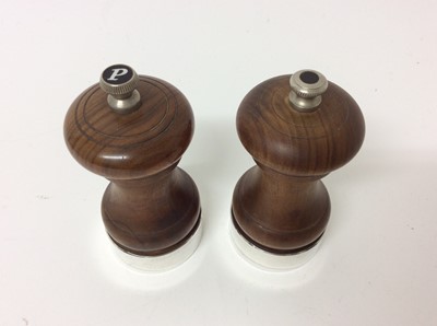 Lot 176 - Pair of silver mounted pepper mills with turned waisted wooden bodies (London 1976), 10.5cm high