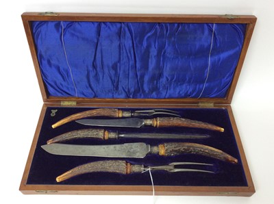 Lot 194 - Edwardian five piece carving set with antler handles and silver ferrells, in original fitted case (Sheffield 1907)