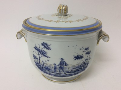 Lot 186 - An Italian Richard Ginori ice pail and cover in the 18th century style, decorated in blue with figures in landscapes and gilded borders, 18cm high overall