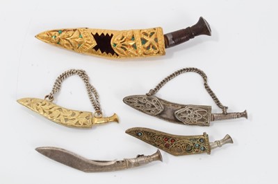 Lot 105 - Five 1920s/30s Indian Kukri dagger brooches some with yellow metal mounts