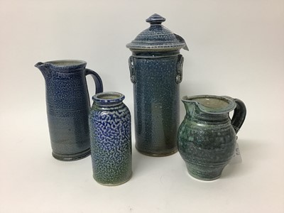 Lot 213 - Four pieces of Deborah Baynes studio pottery including lidded storage jar, 29cm high, two jugs, 19.5cm and 15cm high and a vase, 15.5cm high (all salt glazed)