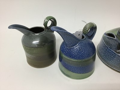 Lot 216 - Three Jane Hamlyn salt glazed studio pottery jugs, 17cm, 15cm and 13cm high plus a Jane Hamlyn teapot, all with monogram