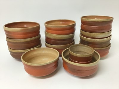 Lot 218 - Collection of Jane Hamlyn rust coloured studio pottery including six soup bowls, six pudding bowls and a beaker, all with monogram to base