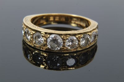Lot 35 - Diamond nine stone ring with a half hoop of nine graduated round brilliant cut diamonds in grain setting with engraved sides on tapered shank. Estimated total diamond weight approximately 1.9cts. R...