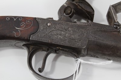 Lot 117 - Pair fine 18th century Queen Anne Flintlock pocket pistols with turn- off cannon barrels by Adams London , trigger guard safety's , fine silver wire inlaid walnut grips with grotesque mask but caps...