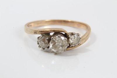 Lot 37 - Diamond three stone ring with three old cut diamonds in cross-over claw setting on 9ct gold shank. Estimated total diamond weight approximately 0.65cts. Ring size O½