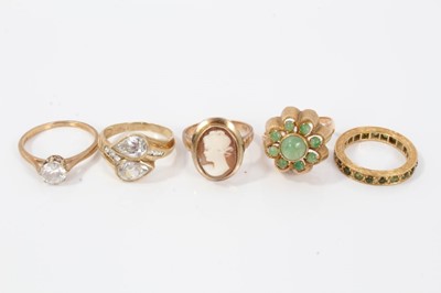 Lot 38 - Five gold and gem-set dress rings, two with synthetic white stones in 9ct gold setting, green cabochon cluster ring in 14ct gold setting, green stone eternity ring an d a 9ct gold cameo ring