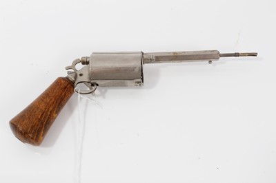 Lot 122 - Edwardian novelty propelling pencil and pen in the form of a revolver with nickel plated frame , the cylinder containing a bullet- shaped inkwell , wooden grip and sprung action .16 cm overall.