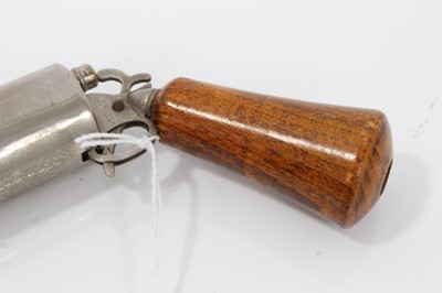 Lot 37 - Edwardian novelty propelling pencil and pen in the form of a revolver with nickel plated frame , the cylinder containing a bullet- shaped inkwell , wooden grip and sprung action .16 cm overall.
