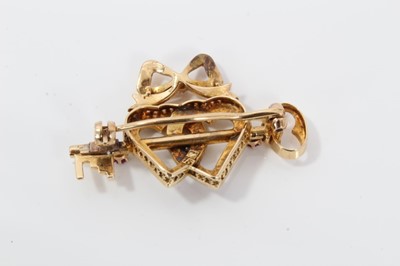Lot 48 - Late Victorian 15ct gold diamond, ruby and seed pearl sweetheart brooch with a gold key and two interlocking hearts surmounted by a bow. 36mm