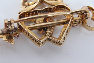 Lot 48 - Late Victorian 15ct gold diamond, ruby and seed pearl sweetheart brooch with a gold key and two interlocking hearts surmounted by a bow. 36mm