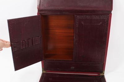 Lot 123 - Good quality Victorian red Morocco leather travelling writing case of book-shaped form with fold out writing slope, pen, ink,  stationary and correspondence compartments .30.5 cm high and wide, 8cm...