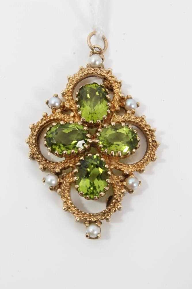 Lot 50 - Victorian style 9ct gold peridot and cultured pearl pendant of quatrefoil form with four oval mixed cut peridots in openwork gold setting, 46m