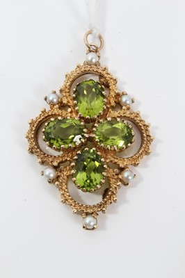 Lot 50 - Victorian style 9ct gold peridot and cultured pearl pendant of quatrefoil form with four oval mixed cut peridots in openwork gold setting, 46m