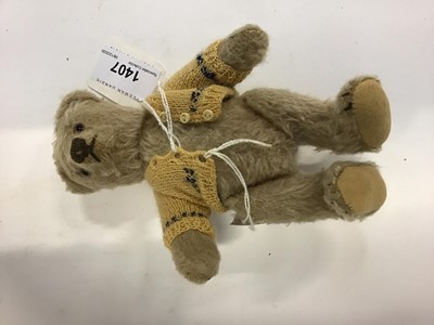 Lot 1407 - Small Steiff bear C 1950's. Steiff button in ear, pale mohair plush, stitched nose and claws and amber glass eyes. Approximately 17cms.