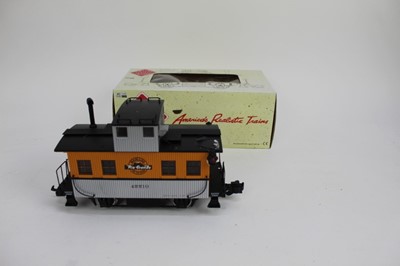 Lot 1431 - Railway Aristocraft 53' Evans Box Cars 50010 and 50016, plus Bobber Caboose 2260C and Center Cab Industrial Switcher 22606C, all boxed.