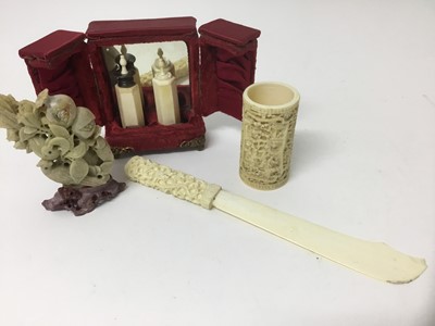 Lot 293 - 19th century Chinese carved canton ivory dice shaker, together with carved ivory paper knife, two lidded scent bottles in fabric lined cases and a soapstone carving