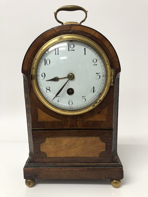 Lot 269 - Late 19th century inlaid mahogany mantel clock with circular white enamel dial, in dome topped case with brass carrying handle, on four brass ball feet, 26cm high