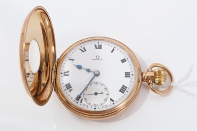 Lot 147 - Gentlemans 9ct gold Omega half Hunter pocket watch with subsidiary seconds , signed dial and stem wind movement - the case 50mm , weighs 94 grams gross