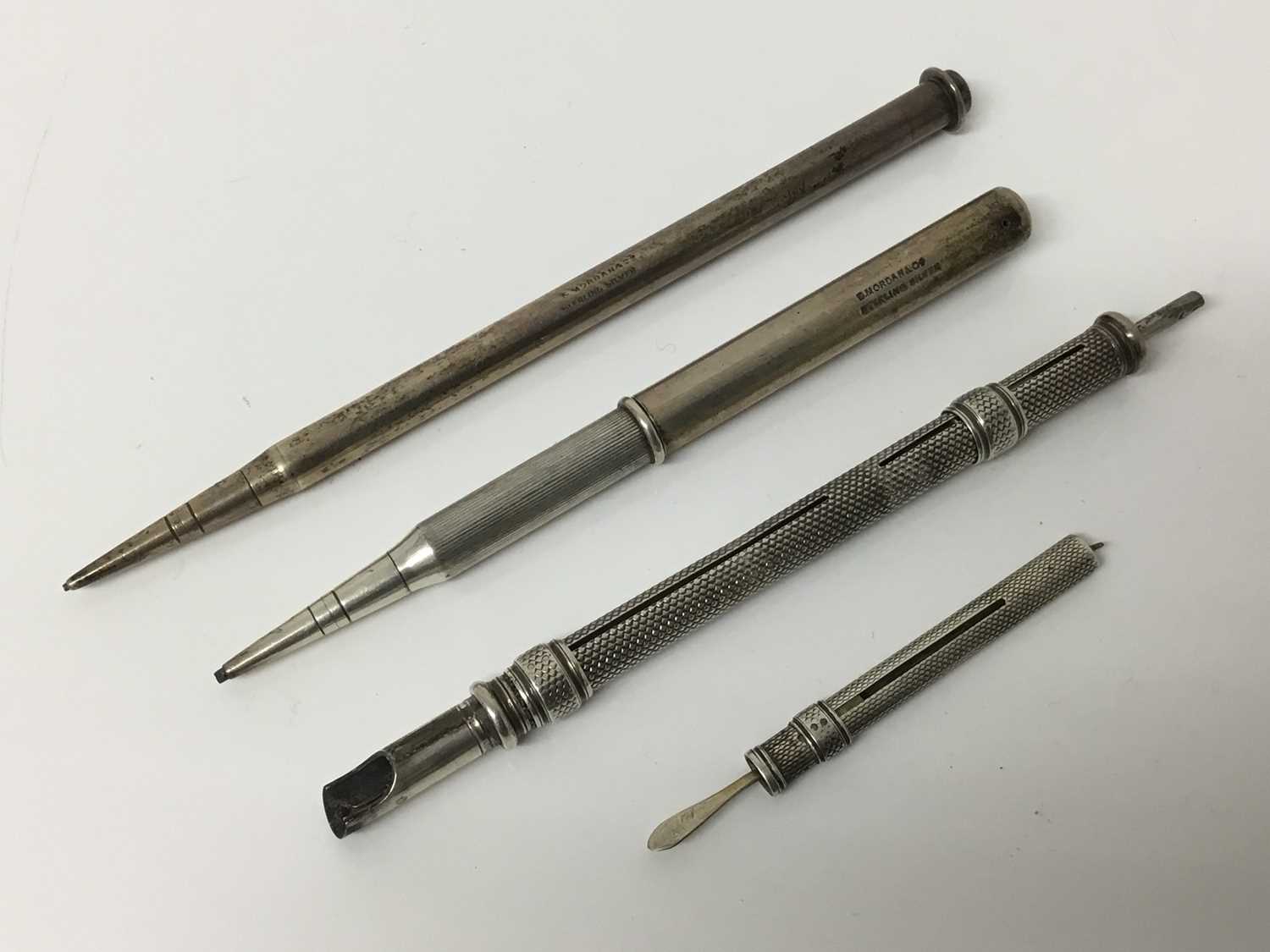 Lot 307 - Group of four Sampson Mordan silver and white metal items to include an engine turned double-ended pen and pencil, engine turned tooth pick and two silver pencils