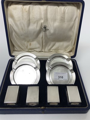 Lot 310 - 1930s Mappin & Webb silver smoking set comprising four engine turned circular ashtrays and four matching match cases, in original fitted case (Birmingham 1938), all at 7ozs