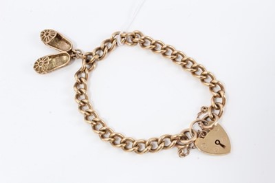 Lot 214 - 9ct gold bracelet charm, hung with shoe charms, with padlock clasp 
total weight 26g