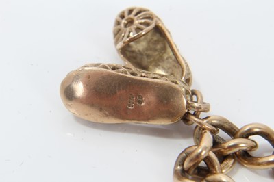 Lot 214 - 9ct gold bracelet charm, hung with shoe charms, with padlock clasp 
total weight 26g