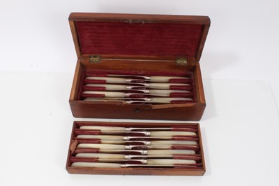 Lot 348 - Fine set 12 George III silver bladed dessert knives with mother o pearl handles and engraved Truelove - Eyre family crest in fitted box. The family who owned this set were friends of Admiral Lord N...