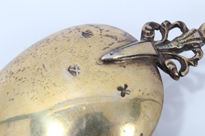 Lot 353 - Pair ornate 19th century Dutch silver gilt serving spoons with cast figure terminals and dolfin decoration 20 cm