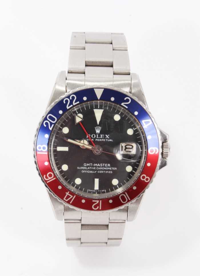 Lot 1 - Rare 1960s gentlemen's Rolex Oyster Perpetual GMT-Master stainless steel wristwatch, model 1675, serial number 1798453, circa 1965-1966, the matte black dial with luminous hour markers and date ape...