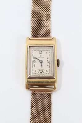 Lot 264 - 1930s gentlemans 18ct gold Omega  retangular wristwatch with silvered dial on 9ct gold mesh bracelet strap