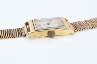 Lot 264 - 1930s gentlemans 18ct gold Omega  retangular wristwatch with silvered dial on 9ct gold mesh bracelet strap