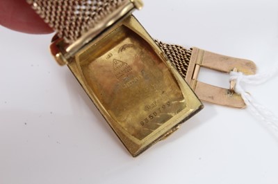 Lot 264 - 1930s gentlemans 18ct gold Omega  retangular wristwatch with silvered dial on 9ct gold mesh bracelet strap