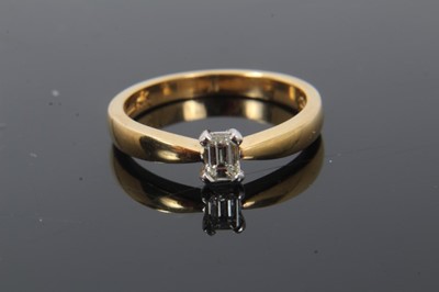Lot 248 - Diamond single stone ring with a rectangular step-cut diamond estimated to weigh approximately 0.25cts in four claw setting on 18ct yellow gold shank. Ring size L½.