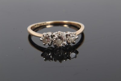 Lot 249 - Diamond three stone ring with three round brilliant cut diamonds in claw setting on 18ct yellow gold shank. Estimated total diamond weight approximately 0.50cts, ring size L.